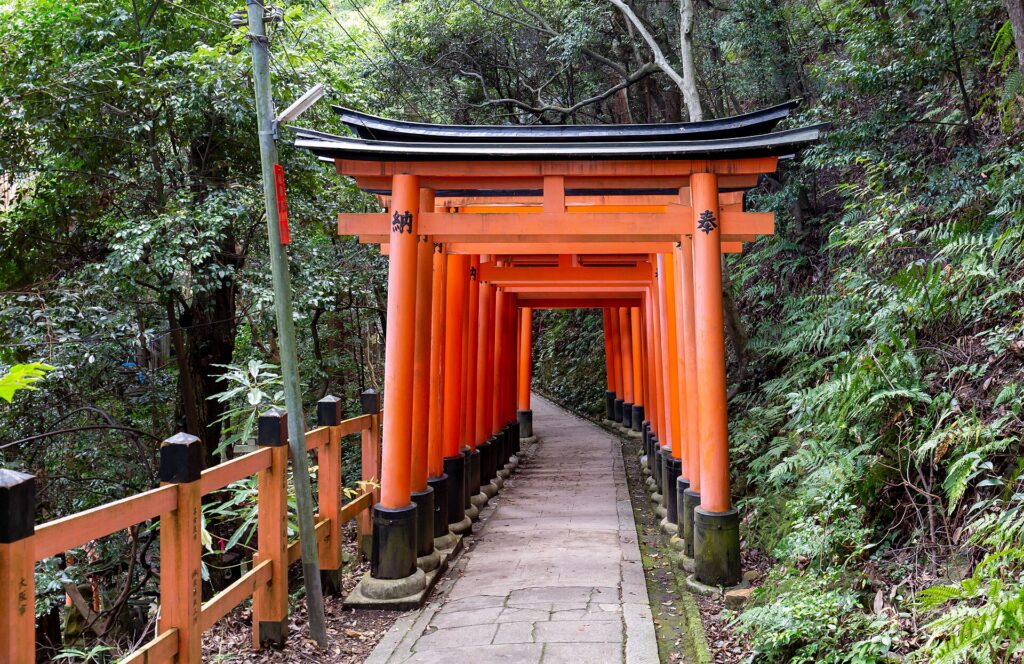 A tunnel of vermilion torii gates at Fushimi Inari Shrine in Kyoto