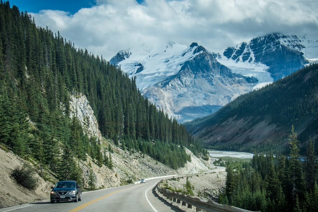 A winding road through the mountains on the Icefields Parkway in Alberta