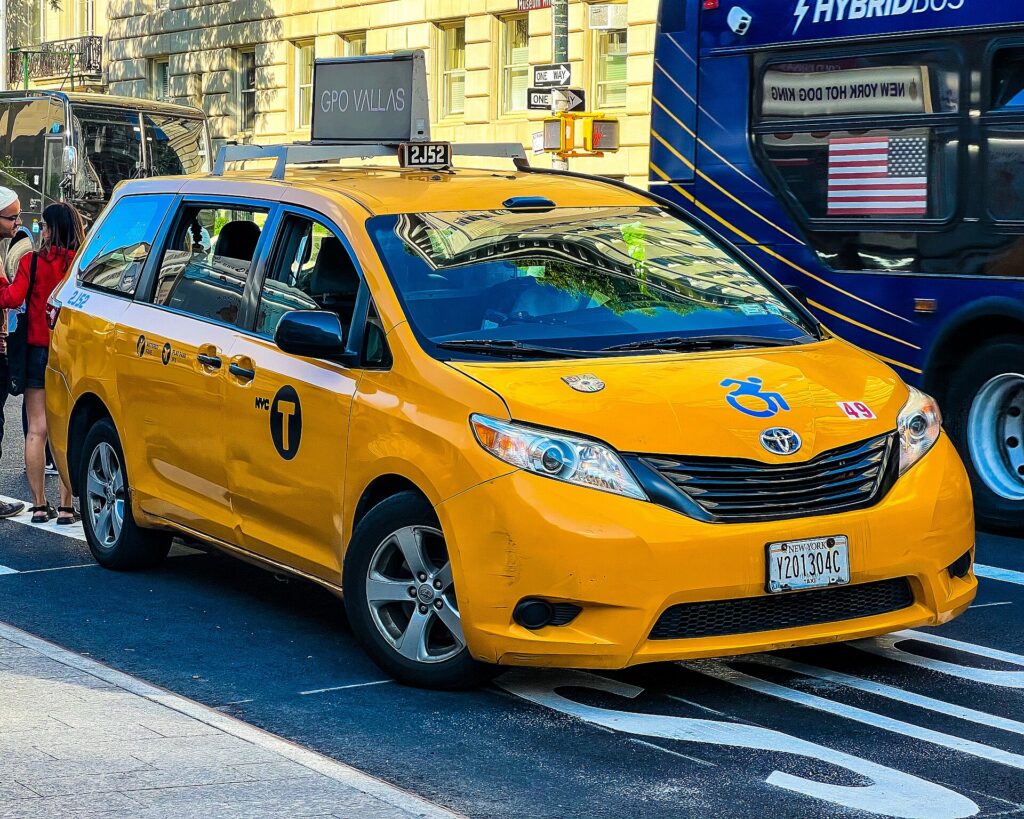A yellow New York City medallion taxi