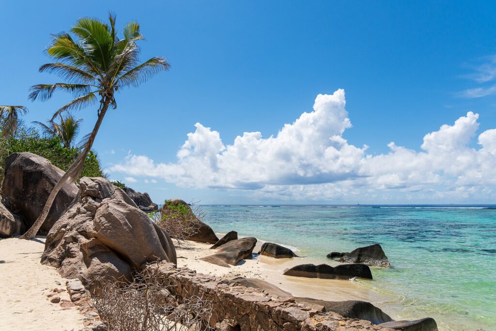 Granite boulders and clear shallow water at Anse Source d'Argent beach on La Digue, Seychelles