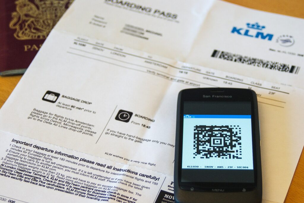 A mobile boarding pass with a 2D barcode on a phone screen