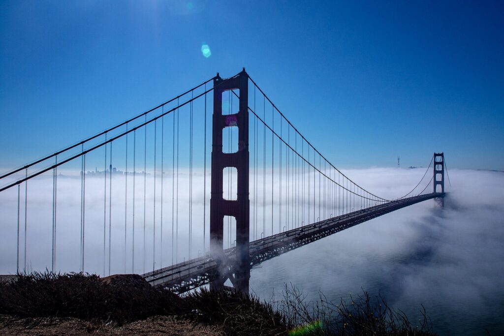 The Golden Gate Bridge rising above the fog, seen from Battery Spencer