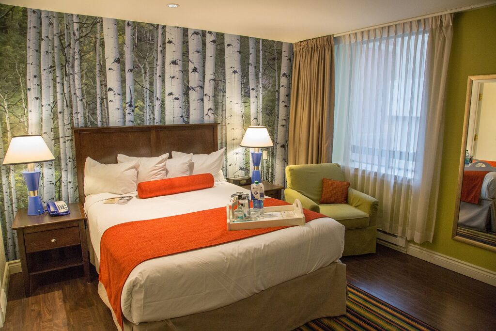 A standard hotel room with a bed and desk in downtown Ottawa