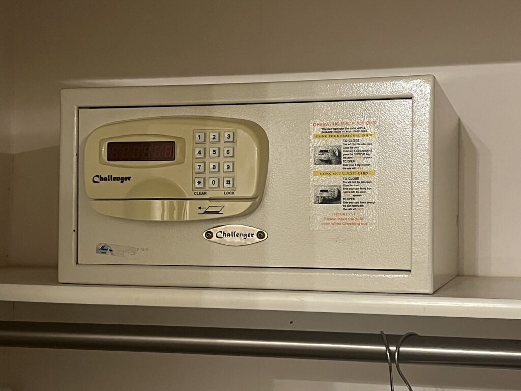 An electronic safe inside a hotel room closet