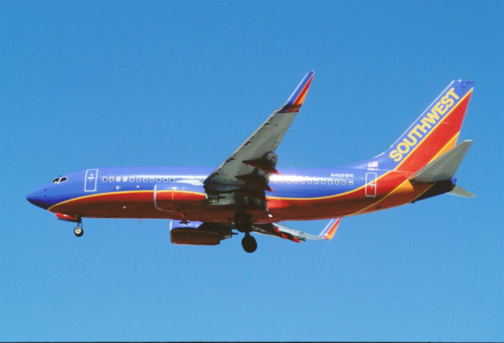 A Southwest Airlines jet climbing over Las Vegas
