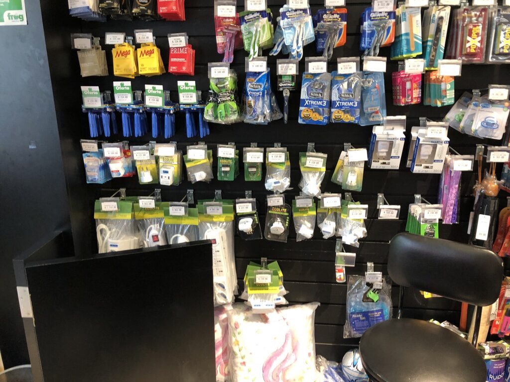 Travel plug adapters and power strips hanging on a store display