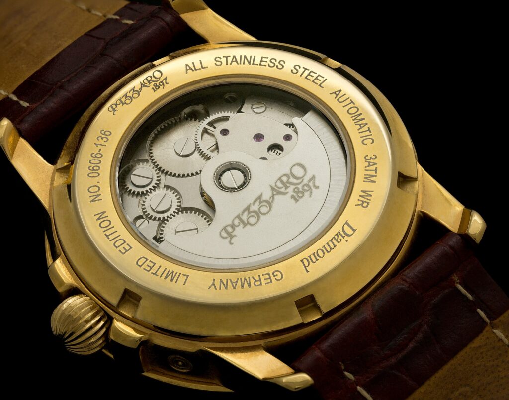 A self-winding wristwatch seen from its transparent case back