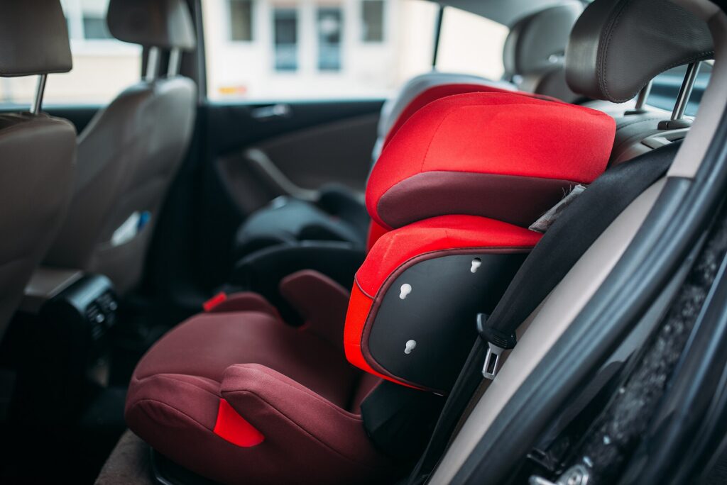 A child car seat installed in the back seat of a car