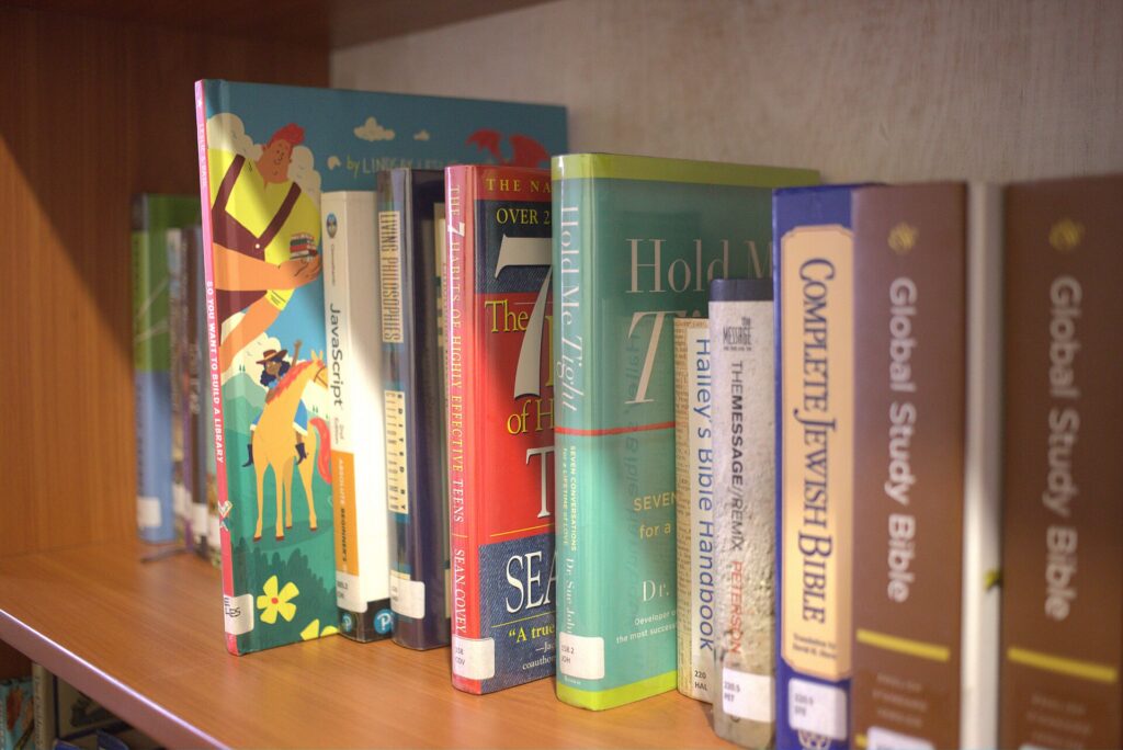 Shelves of children's books in the children's section of a public library