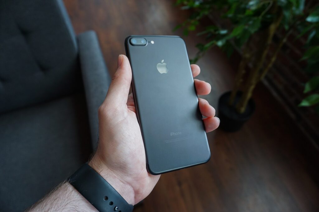A hand holding a smartphone