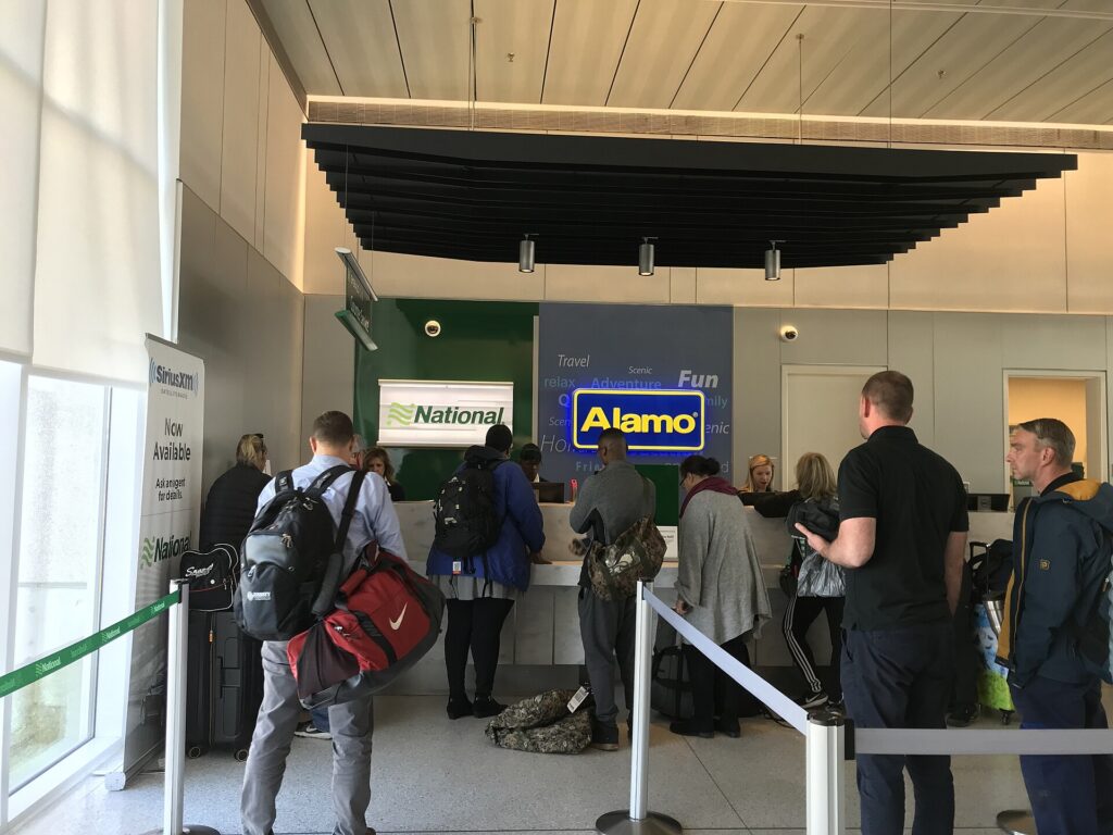 National and Alamo car rental counters at an airport