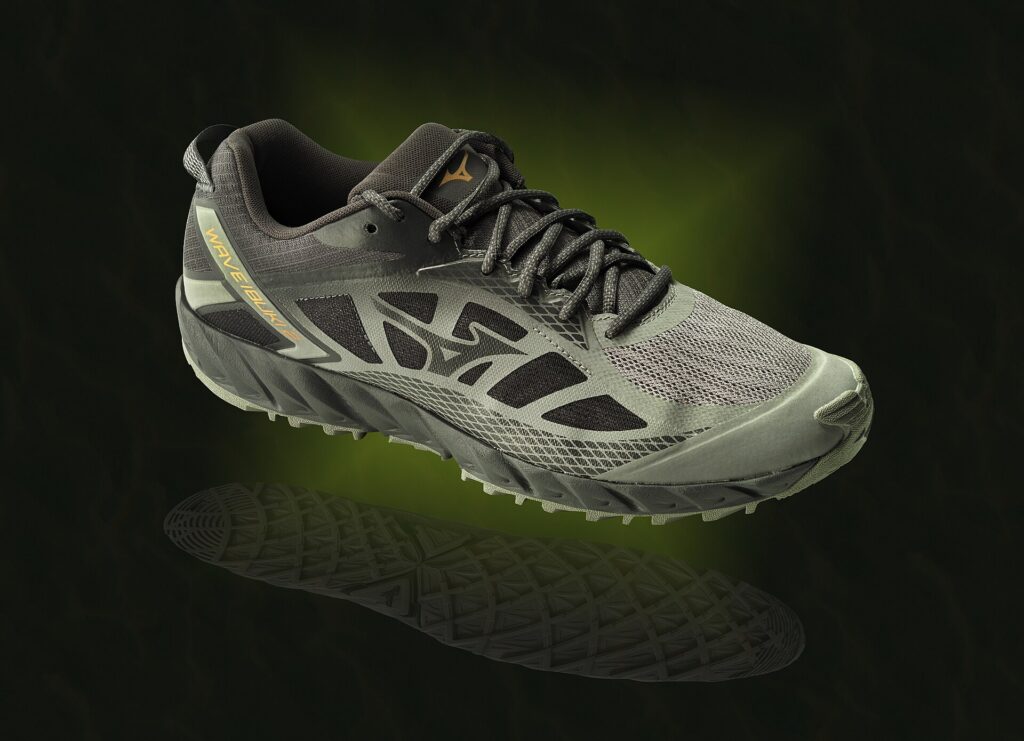A pair of trail running shoes with a lugged outsole