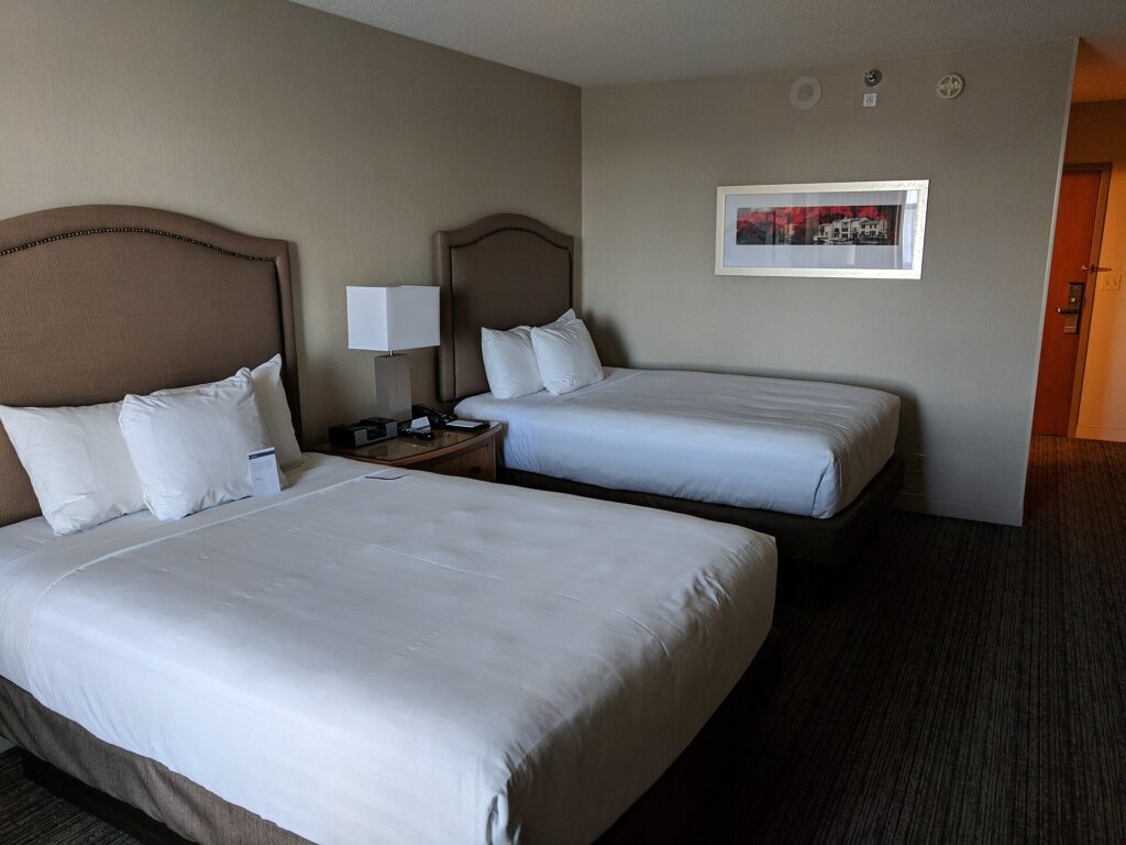 A hotel room with two beds, the standard family layout