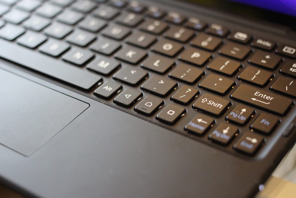Close-up of a slim Bluetooth keyboard attached to a tablet
