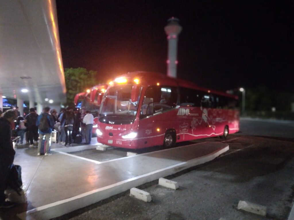 ADO bus platforms outside a terminal at Cancun International Airport