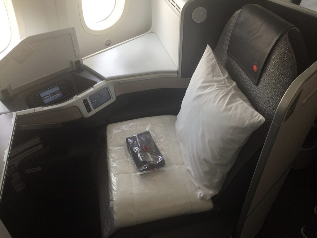 A lie-flat business class pod on an Air Canada long-haul aircraft