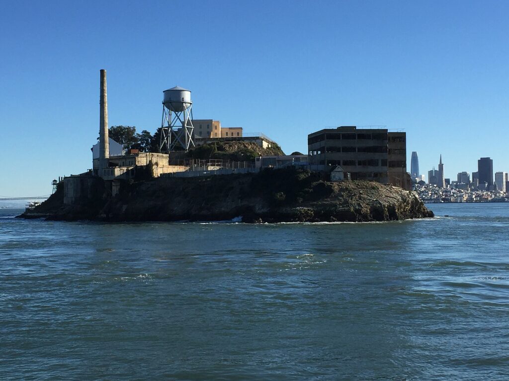 Alcatraz Island and its cellhouse seen from a boat on San Francisco Bay