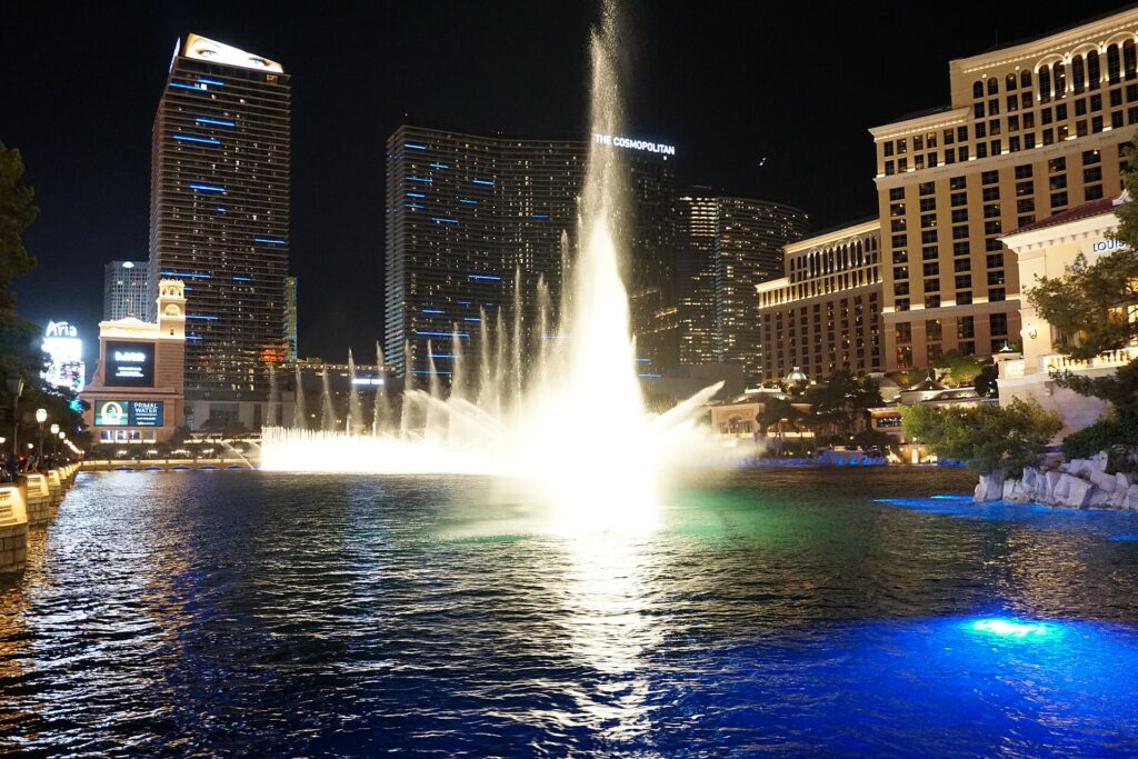 The Bellagio fountains lit up at night on the Las Vegas Strip
