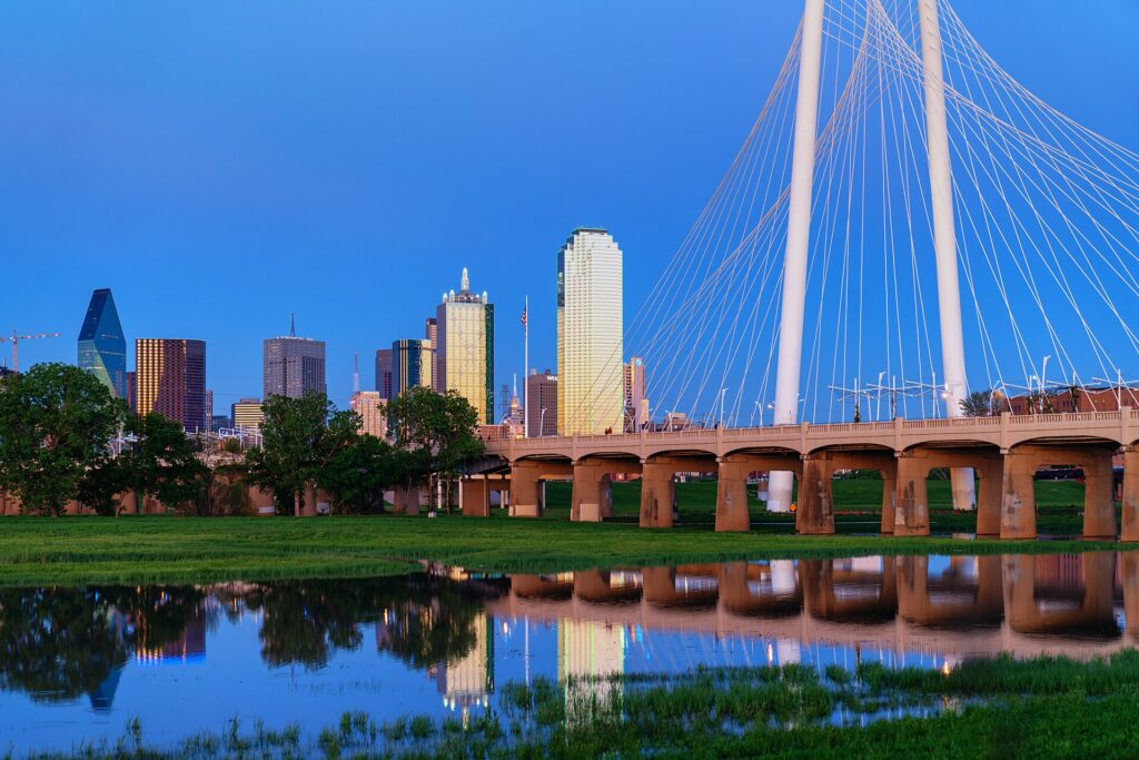 The Dallas skyline across the Trinity River with the Margaret Hunt Hill Bridge