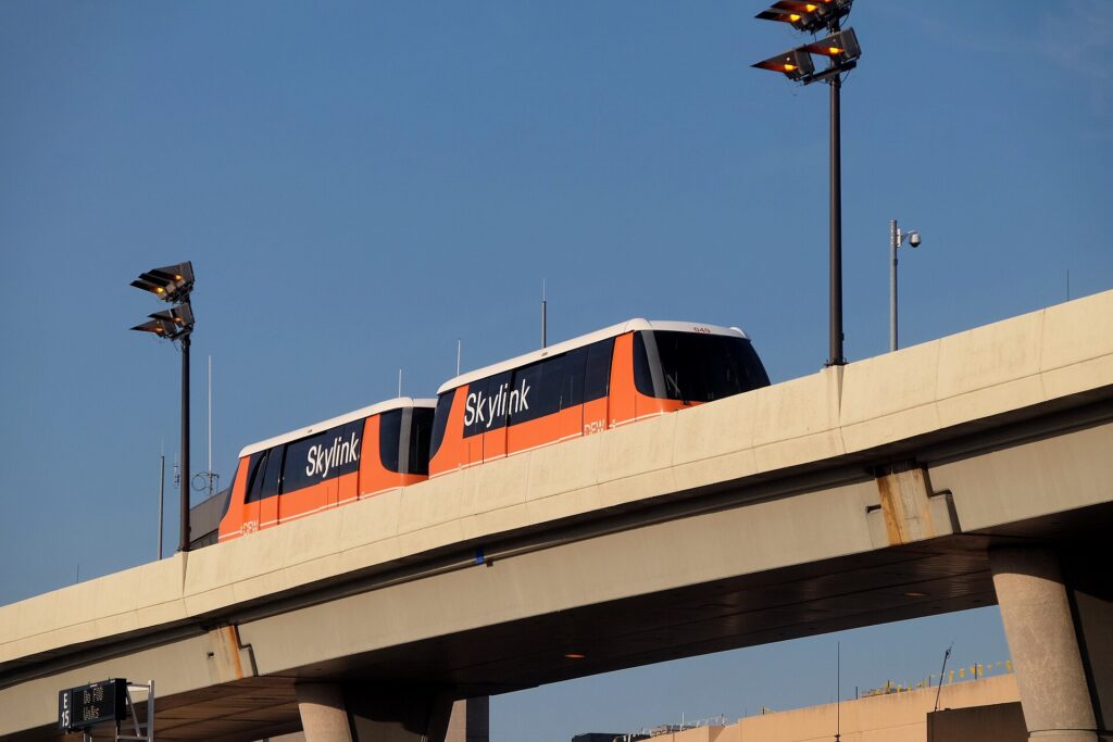 The Skylink train running past Terminal E at Dallas Fort Worth International Airport