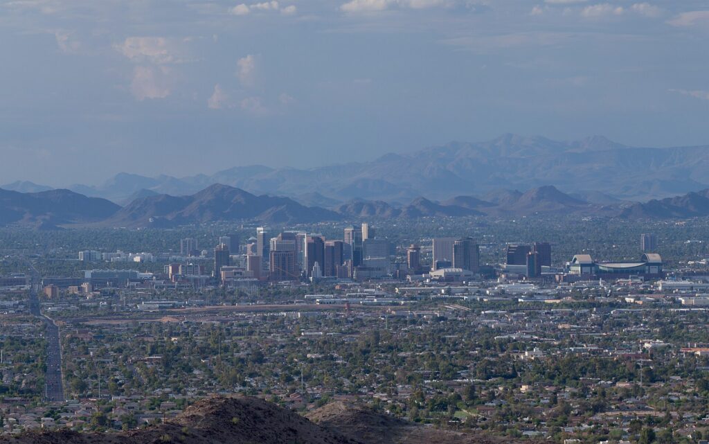 The downtown Phoenix skyline with desert mountains behind