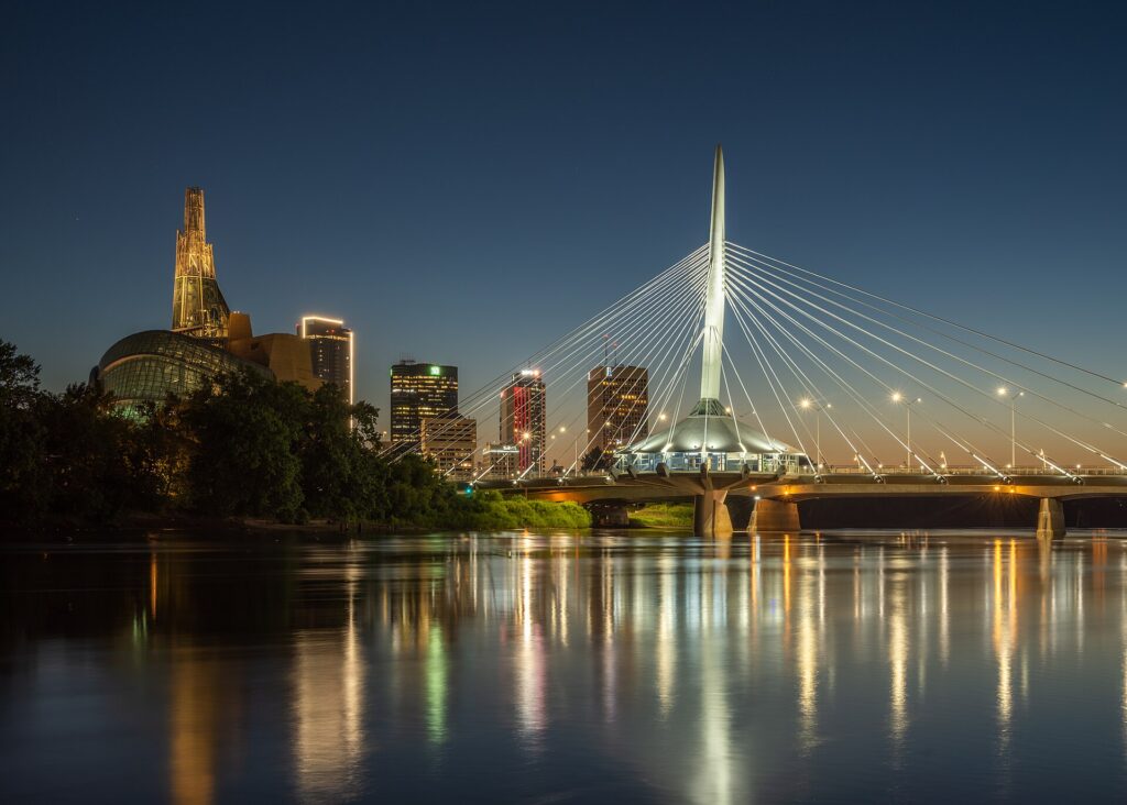 The Esplanade Riel footbridge and the Winnipeg skyline at dusk
