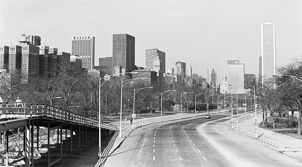 Lake Shore Drive running north along Lake Michigan in the evening