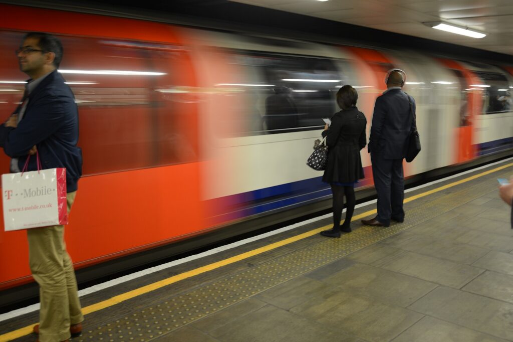 A London Underground Central line train leaving Mile End station