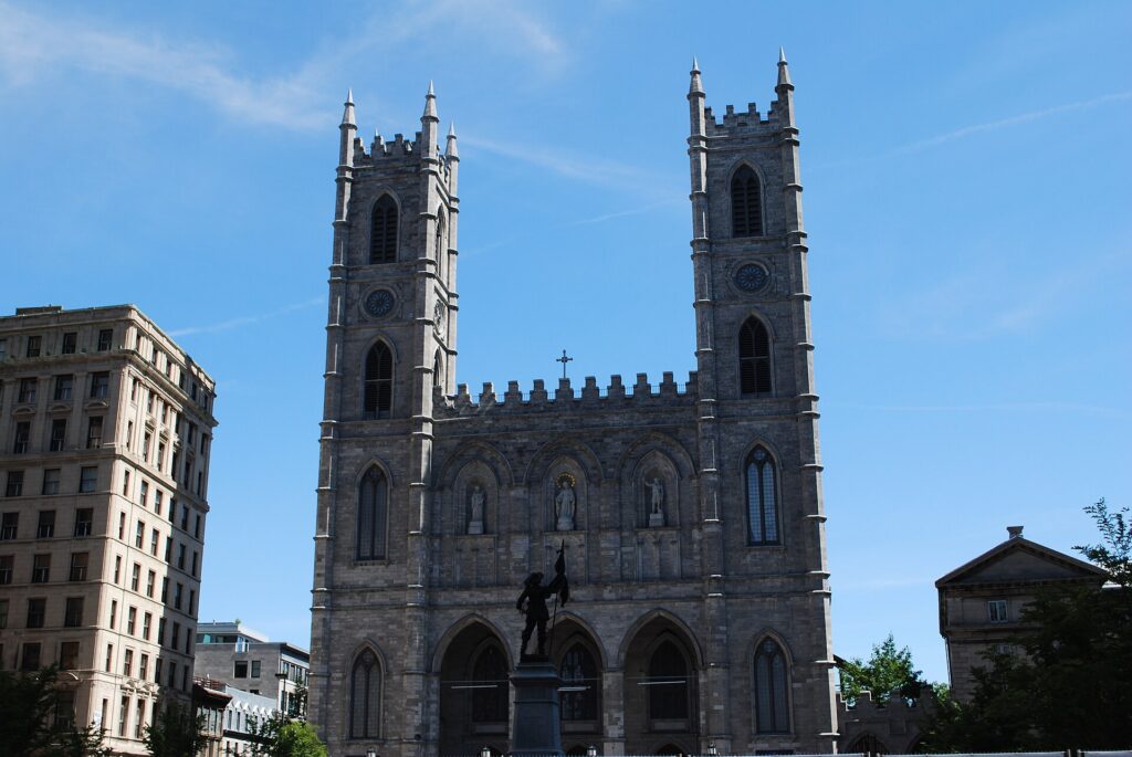 The twin-towered façade of Notre-Dame Basilica on Place d'Armes in Old Montreal