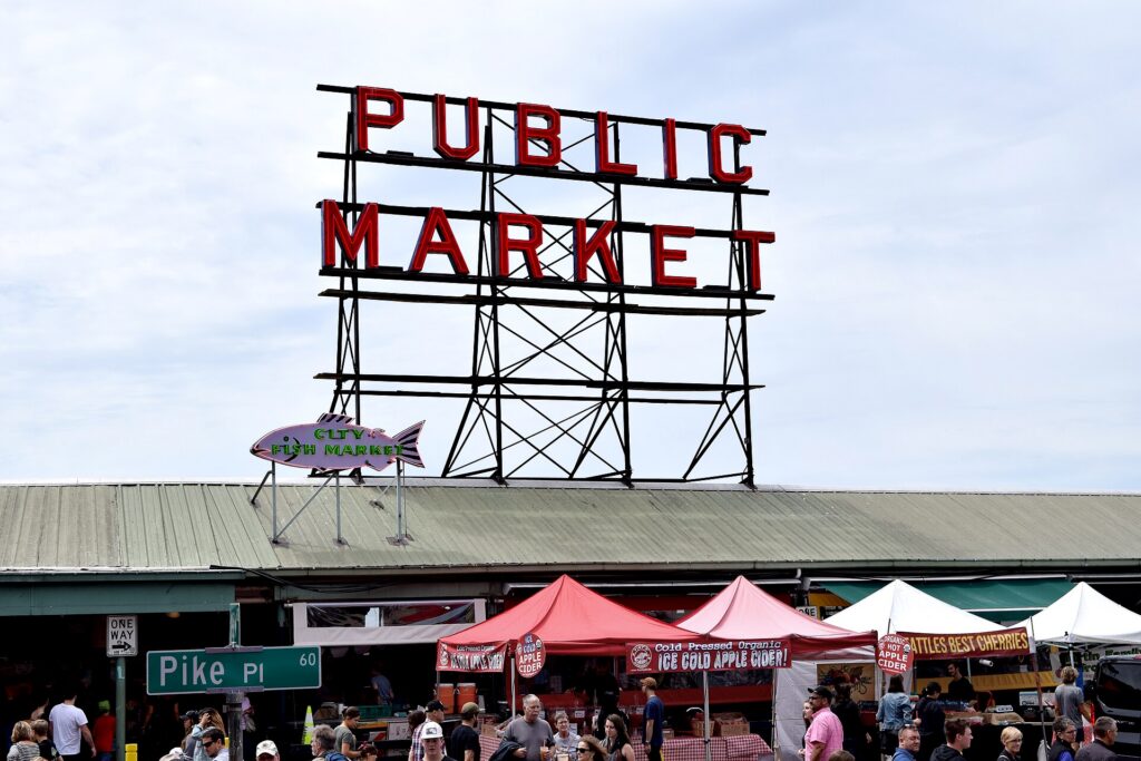The neon Public Market Center sign and clock at Pike Place Market