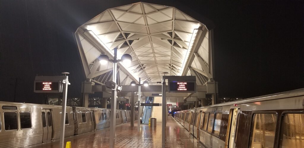 An Orange Line train arriving at Farragut West, one of the Metro's vaulted concrete stations